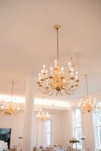 a beautiful chandelier in The Maki Ballroom
