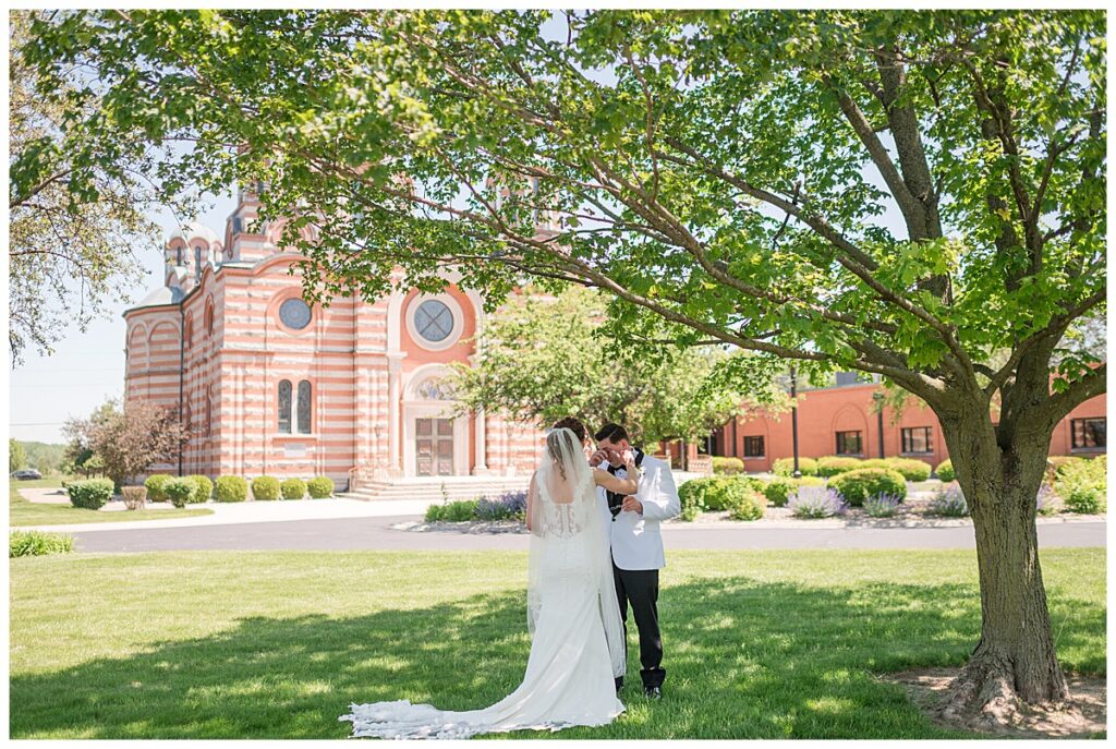 Bride and groom first look before ceremony at St. Elijah Serbian Orthodox Cathedral Merrillville